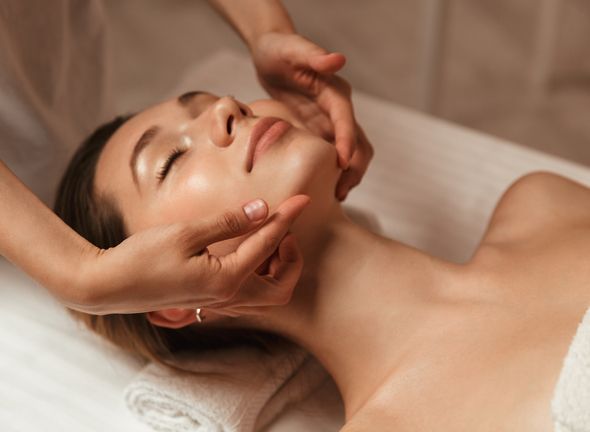 woman getting facial spa treatment