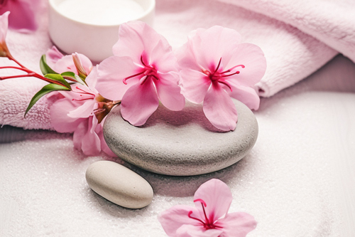 pink spa towel and grey stones